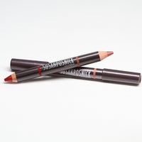 Susan Posnick Cosmetics ColorDuo Pencils resting on top of each other.